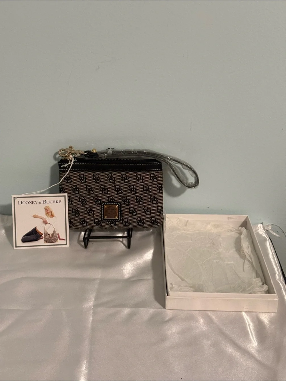 Dooney and Bourke NWT Medium logo wristlet. Comes in a box!